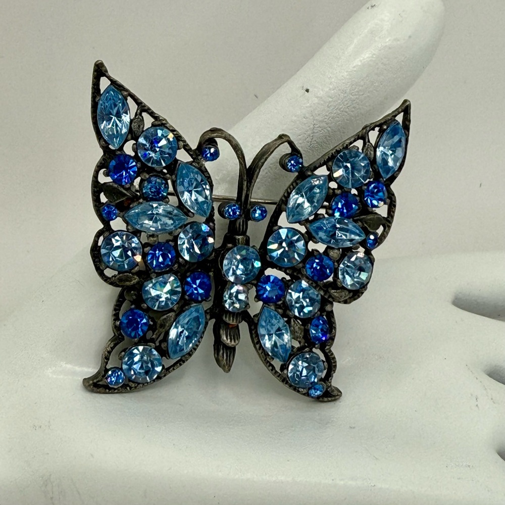 Multicolor Blue Rhinestone Butterfly Brooch in Gun Metal Setting.
